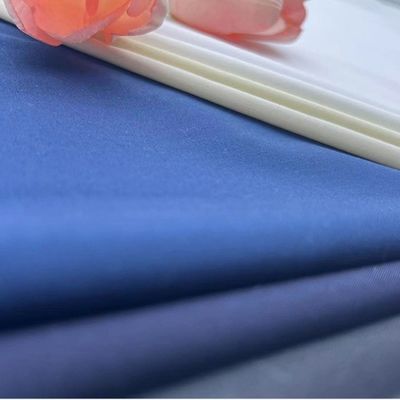 Tejido de camisa de algodón de color personalizado de peso medio para hombres y mujeres de Jinsuo Textile
